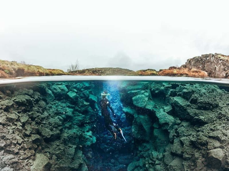 From Reykjavik: Silfra Snorkeling with Free Photos - The safety briefing and first entry