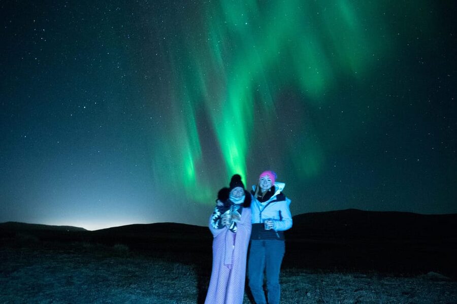 Northern Lights in Mini Bus, Photos, Hot Cocoa and Pastries - Waiting Comfortably With Cocoa and Pastries