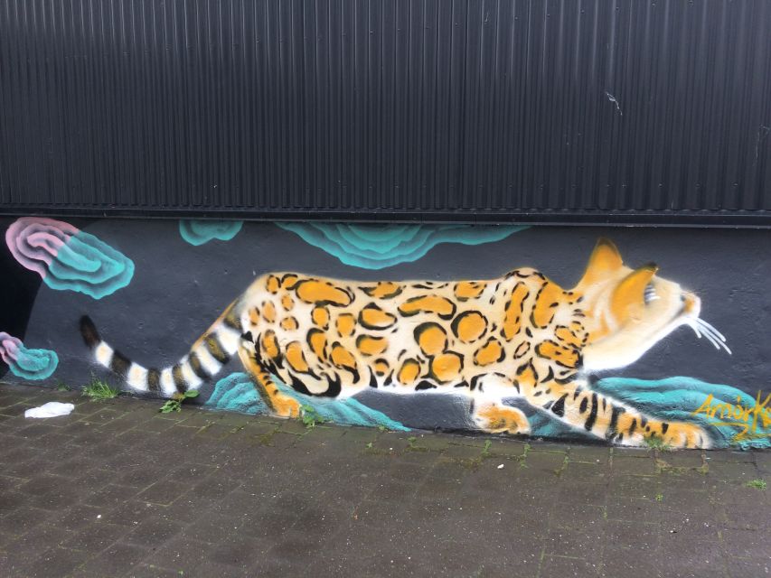 Reykjavik: Guided City Walking Tour - Tjornin, local tastings, and a pause