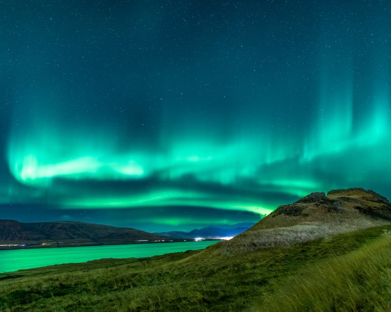 Reykjavik: Northern Lights Group Tour with Photos - Hot chocolate, cold air, and practical comfort