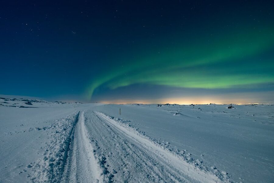 Reykjavík: Northern Lights Minibus Tour with Photos - Hot chocolate, blankets, and standing outside