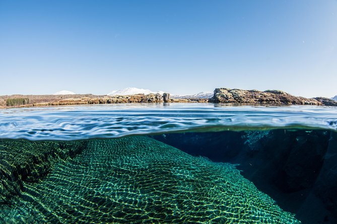 Silfra: Snorkeling Between Tectonic Plates Pick Up from Reykjavik - Getting ready in the heated changing van