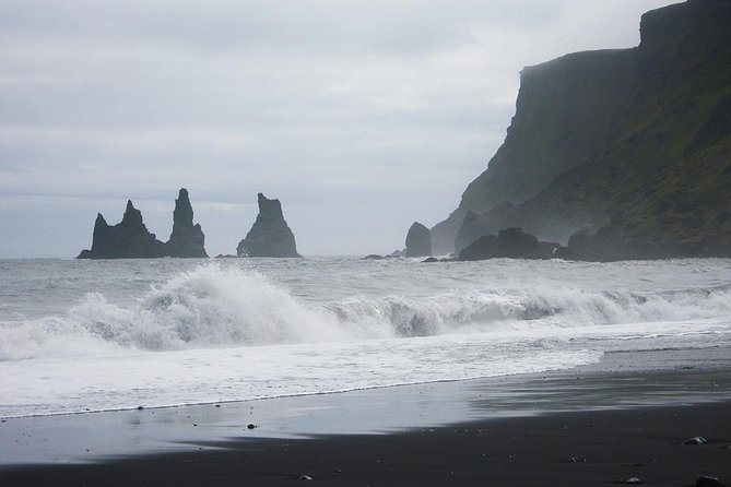 South Coast and Glacier Lagoon Day Trip by Super Jeep from Reykjavik - Dyrhólaey and Reynisfjara show the hard edge of the coast