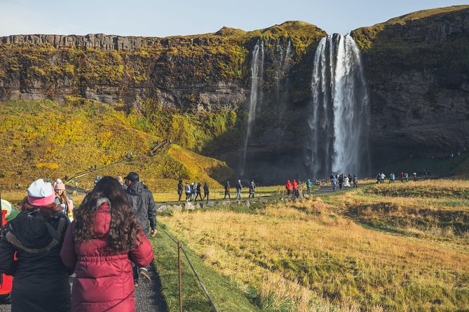 South Coast Day Tour Black Sand Beach & Waterfalls from Reykjavik - Touching the edge of Solheimajokull