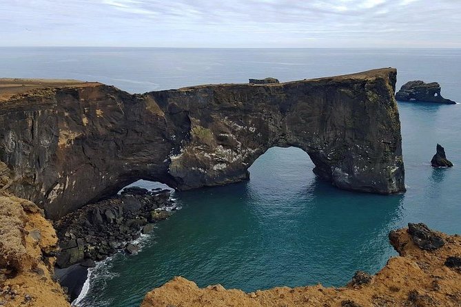 South Coast. Private Day Tour from Reykjavik - Dyrhólaey: cliffs, ocean, and glacier views