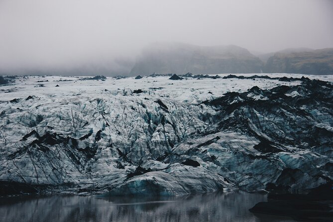 South Coast, Waterfalls and Black Sand Beach (Small Group Tour) - Sólheimajökull shows Iceland’s ice up close